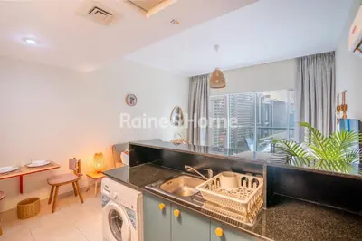 a kitchen with a sink and a dishwasher at RH- Modern studio walk away from Burj khalifa and Dubai Mall in Dubai
