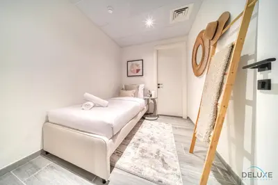 a room with two beds and a ladder at Peaceful 2BR with Assistant Room at Mesk 1 Midtown Dubai Production City by Deluxe Holiday Homes in Dubai