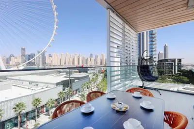 a dining room with a view of the city at Livbnb - Alluring 3BR Plus Maid's with Sea & Ain Dubai View in Dubai