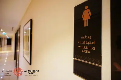 a sign on the wall of a wellness area at Alashrafia Saray- Splendid 1BR apartment in Canal Views in Dubai