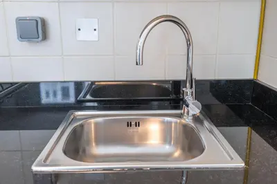 a stainless steel sink in a kitchen at Sleek Studio in Dubai's Vibrant JBR Neighborhood in Dubai