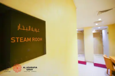 a sign on a wall in a room at Alashrafia Saray- Cozy 2BR apartment in Canal Views in Dubai