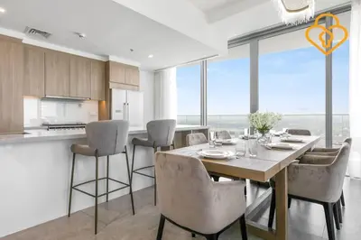 a kitchen and dining room with a table and chairs at Keysplease Luxury 3 B/R Fascinating Sea & Dubai Marina Views in Dubai