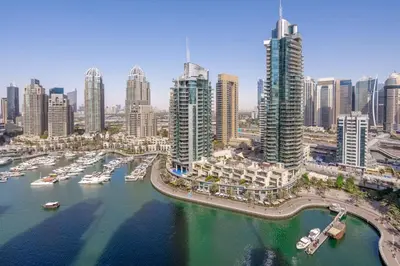 an aerial view of a city with boats in the water at GuestReady Holiday Homes - Boho Marina Dream in Dubai