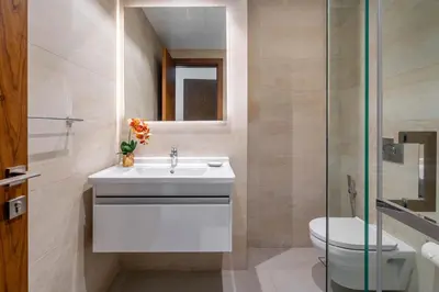 a bathroom with a sink and a toilet at GuestReady Holiday Homes - Boho Marina Dream in Dubai