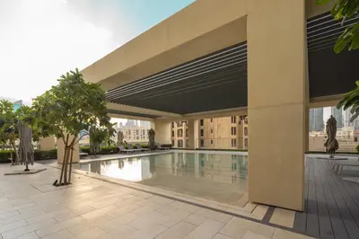 a swimming pool in the middle of a building at Prime Retreats @ Burj Royale By Emaar in Dubai