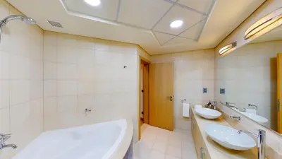 a bathroom with two sinks and a tub at Al Dabas Beach Views, 3BD Sleeps 6, Beachfront Beach & Pool Access - DVH Holiday Homes in Dubai