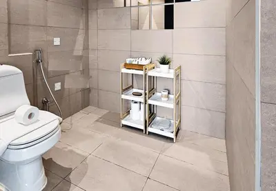a bathroom with a white toilet and a shower at Serene 1BR with Stunning Marina Views in Dubai Marina - The Atlantic in Dubai