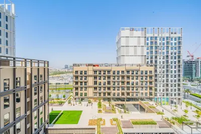 an aerial view of a city with tall buildings at Chic 1BR in Park Heights 2 - Dubai Hills in Dubai