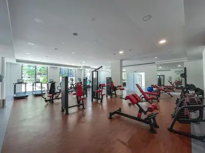 a gym with a bunch of treadmills and machines at Vogue Madinat Jumeirah Living Rahaal Near Burj Al Arab One Bedroom Apartment with Balcony and Vibrant Community View, Access to all Amenities in Dubai