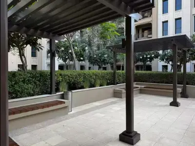 a pavilion in a city with benches and a building at Vogue Madinat Jumeirah Living Rahaal Near Burj Al Arab One Bedroom Apartment with Balcony and Vibrant Community View, Access to all Amenities in Dubai