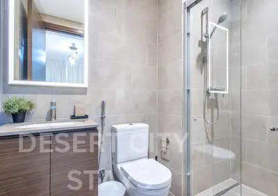 a bathroom with a shower and a toilet and a sink at 2 Bed in Sobha Creek Vista Reserve with Burj Khalifa views hosted by Desert City Stays in Dubai