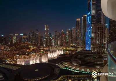 a view of a city at night with buildings at Deluxe - Address Dubai Mall - The Residence in Dubai