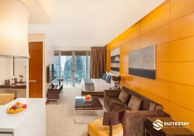 a living room with a couch and a bed at Deluxe - Address Dubai Mall - The Residence in Dubai
