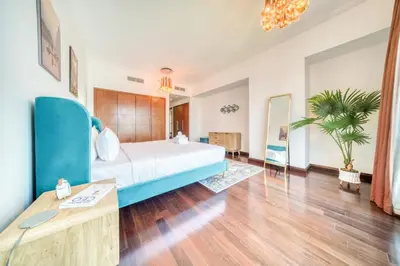 a bedroom with a bed and a desk in a room at South Ridge 2, Downtown Dubai - Mint Stay in Dubai