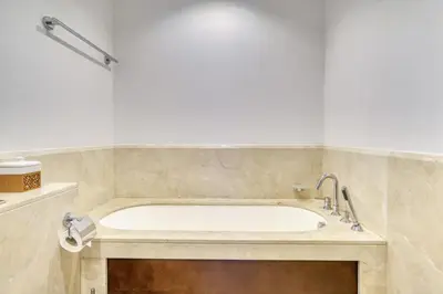 a bathroom with a large tub in a room at South Ridge 2, Downtown Dubai - Mint Stay in Dubai