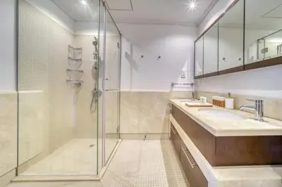 a bathroom with a shower and a sink at South Ridge 2, Downtown Dubai - Mint Stay in Dubai