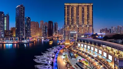 a city at night with boats in the water at Panoramic Luxe 1BR with Breathtaking Views at Dubai Marina Near JBR - Silverene Towers in Dubai