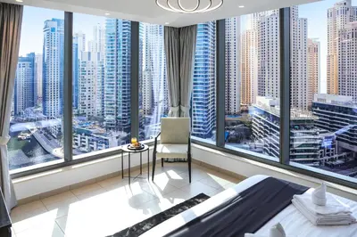 a bedroom with a large window with a view of a city at Panoramic Luxe 1BR with Breathtaking Views at Dubai Marina Near JBR - Silverene Towers in Dubai