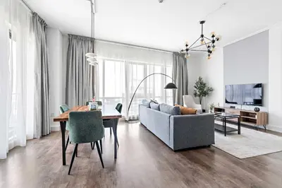 a living room with a couch and a table at Silkhaus high floor 1BDR in Southridge in Dubai