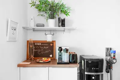 a kitchen with a counter with a coffee maker at 76th floor- 2 BR Apartment with Iconic Marina Skyline View in Dubai