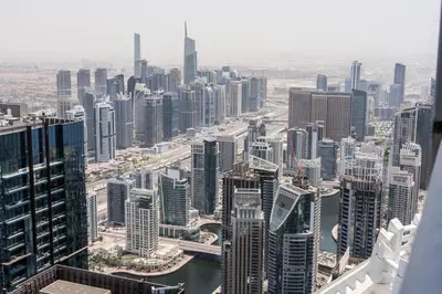 an aerial view of a city with tall buildings at 76th floor- 2 BR Apartment with Iconic Marina Skyline View in Dubai