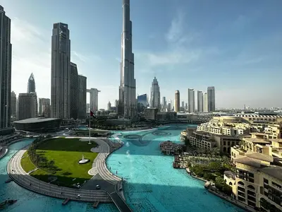 a view of a city with a river and buildings at Durrani Homes - Supreme 5BR besides Dubai Mall With Burj Khalifa and Fountain view in Dubai