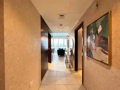 a hallway of a house with a painting on the wall at Durrani Homes - Supreme 5BR besides Dubai Mall With Burj Khalifa and Fountain view in Dubai