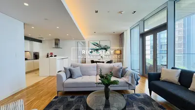 a living room with a couch and a table at Crystal Clear 1BR in Blue Waters with Ain View in Dubai