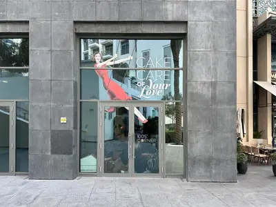 a window of a building with a sign in it at Trophy Lux 2BR Creek Harbour Suites with Iconic Burj Khalifa Views in Dubai