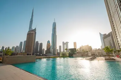 a large swimming pool in the middle of a city at Prime Retreats @ Downtown Views by Emaar in Dubai