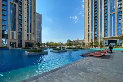 a large swimming pool in a city with tall buildings at Breathtaking 1Bed with balcony in Al Habtoor city in Dubai