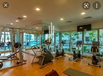 an image of a gym with treadmills and ellipticals at Bellavista - Ultra Modern - 2BR - Boulevard Central - Burj Khalifa View in Dubai
