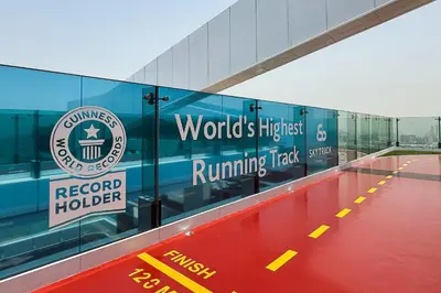 a building with the words worlds highest running track at Vogue Al Wasl 1 Residences Near Zabeel Park and World Trade Centre, Two Bedroom Apartment with Balcony and City View, Access to all Amenities, Walkable to Max Fashion Metro Station in Dubai