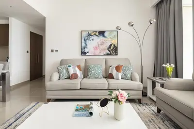 a living room with a couch and a table at Frank Porter - 17 Icon Bay in Dubai