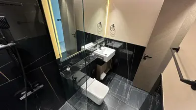 a bathroom with two sinks and a mirror at LUXURY 2 bedrooms 5 minutes from Burj Khalifa in Dubai