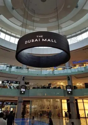 a sign for the dubai mall in a shopping mall at Fashion Avenue - Dubai Mall in Dubai