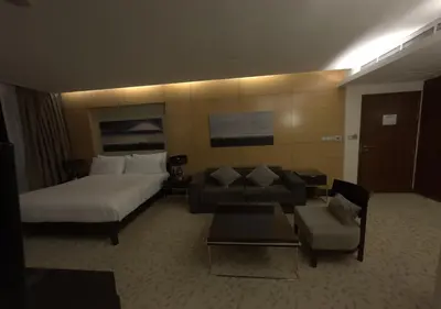 a hotel room with a bed and a couch at Fashion Avenue - Dubai Mall in Dubai