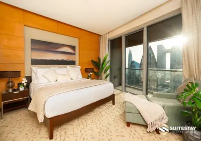 a bedroom with a bed and a large window at Fashion Avenue - Dubai Mall in Dubai