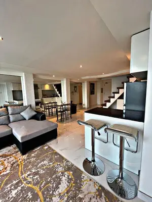a living room with a couch and a piano at Stunning Duplex Studio in JLT in Dubai