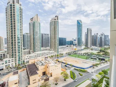 an aerial view of a city with tall buildings at Radiant 1BR in Burj Royale - Downtown Dubai in Dubai