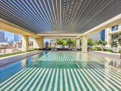 a swimming pool in a building with a ceiling at Radiant 1BR in Burj Royale - Downtown Dubai in Dubai