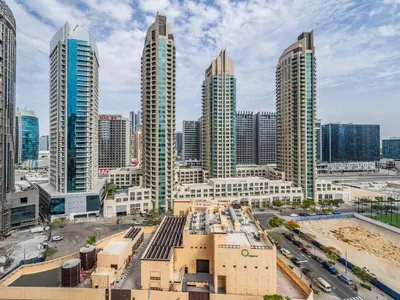 a city skyline with tall buildings and a street at Pleasant 1BR in Burj Royale - Downtown Dubai in Dubai