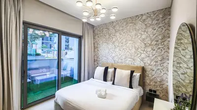 a bedroom with a bed and a large window at STAY BY LATINEM Luxury 1BR Holiday Home CV A103 near Burj Khalifa in Dubai