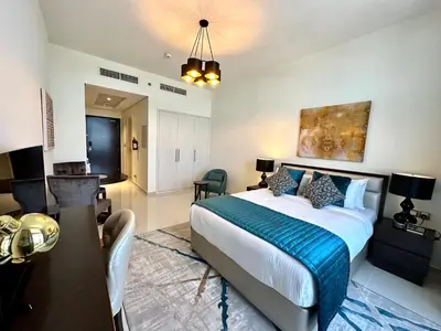 a bedroom with a bed and a living room at LuxBnB Studio Ghalia J V C in Dubai