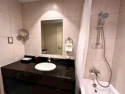 a bathroom with a sink and a shower at LuxBnB Studio Ghalia J V C in Dubai