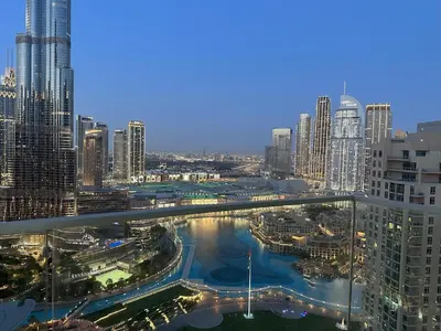 a view of a city with a river and buildings at Opera Grand by Luxstay Holiday Homes in Dubai