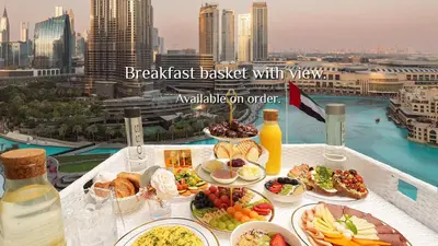 a breakfast breakfast basket with views of a city at Elite Royal Apartment Full Burj Khalifa & Fountain View - Czar in Dubai