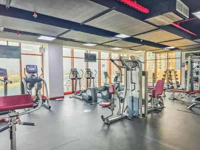a gym with several treadmills and exercise bikes at Minimalistic Studio in Palm Views - Palm Jumeirah in Dubai