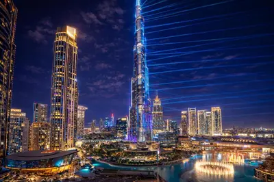 a view of a city skyline at night at Elite Royal Apartment - Full Burj Khalifa & Fountain View - King in Dubai